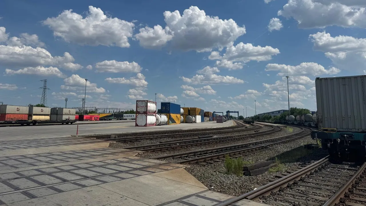 Rail side of the Arad terminal: loading tracks with wagons, stacked containers and tank containers behind